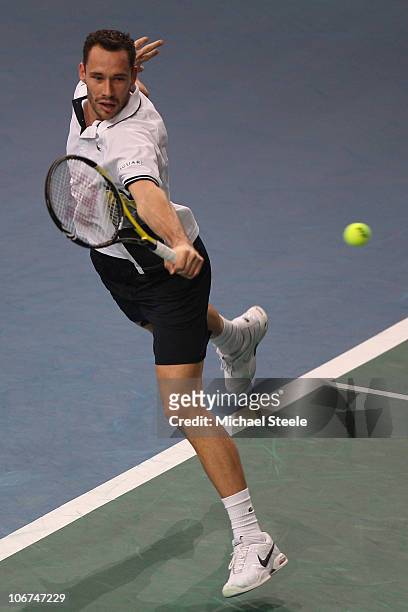 Michael Llodra of France in action against Novak Djokovic of Serbia during Day Five of the ATP Masters Series Paris at the Palais Omnisports on...