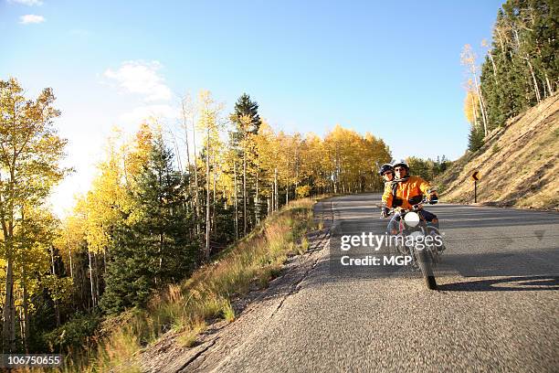 senior couple rides motorcycle - motorcycle travel stock-fotos und bilder