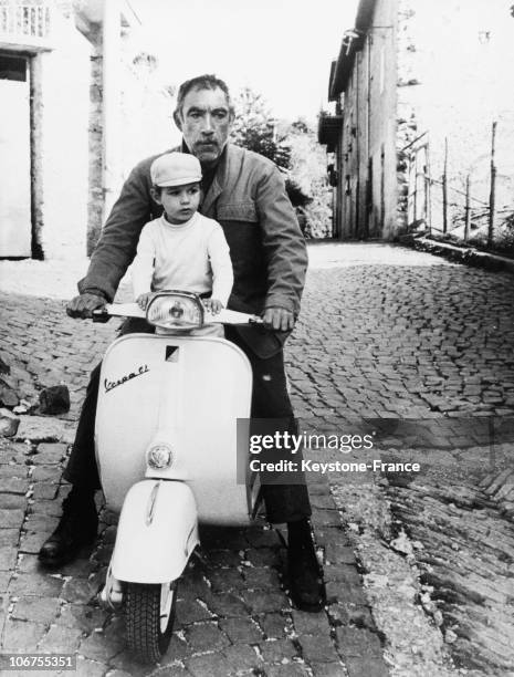 Anthony Quinn And His Son Lorenzo Driving A Vespa Scooter. 1968