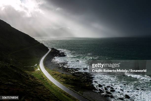 coastal road, vikten, norway - foggy road stock pictures, royalty-free photos & images