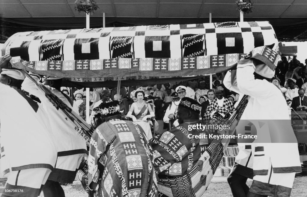 Sierra Leone, Bo Province. Hm The Queen Elizabeth Ii And Prince Philip Watching A Procession Of Chiefs And Their Devil Dancers In November 1961.