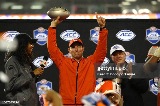 Clemson Tigers head coach Dabo Swinney hold up the trophy after winning the ACC Championship game between the Pittsburgh Panthers and the Clemson...