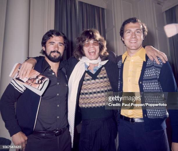 Bayern Munich footballers Gerd Muller and Franz Beckenbauer with Mick Jagger at the Central Hotel in Glasgow, prior to the European Cup Final at...