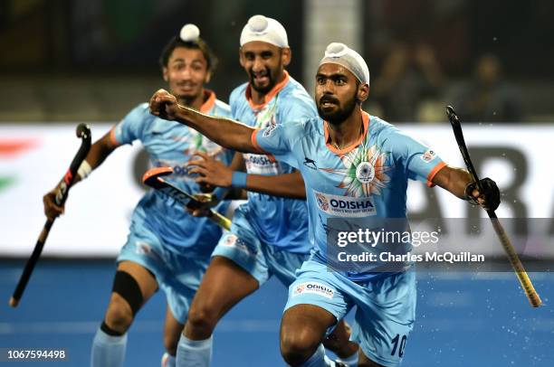 Simranjeet Singh of India celebrates scoring during the FIH Men's Hockey World Cup Group C match between India and Belgium at Kalinga Stadium on...