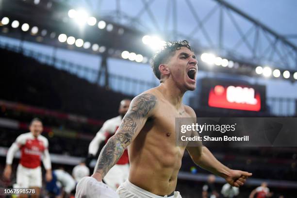 Lucas Torreira of Arsenal celebrates after scoring his team's fourth goal during the Premier League match between Arsenal FC and Tottenham Hotspur at...