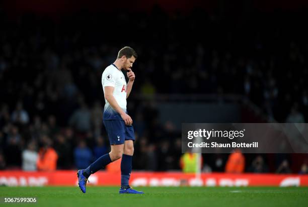 Jan Vertonghen of Tottenham Hotspur walks off the pitch after being shown a second yellow card during the Premier League match between Arsenal FC and...