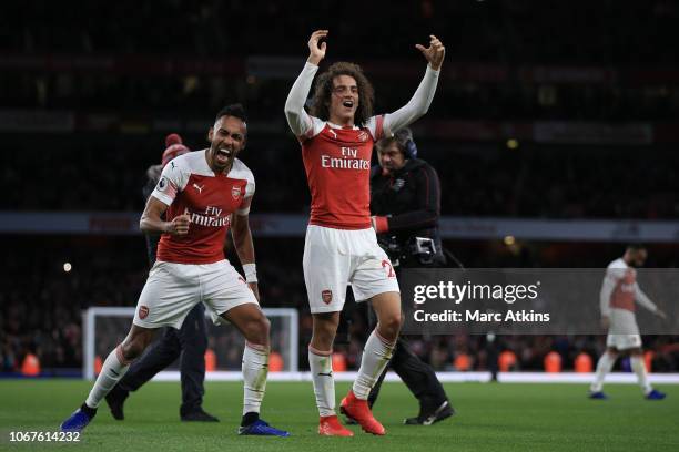 Pierre-Emerick Aubameyang and Matteo Guendouzi of Arsenal celebrate the win during the Premier League match between Arsenal FC and Tottenham Hotspur...