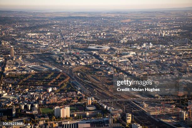 aerial flying over paris france with view of stade de france at sunrise - saint denis paris stock-fotos und bilder