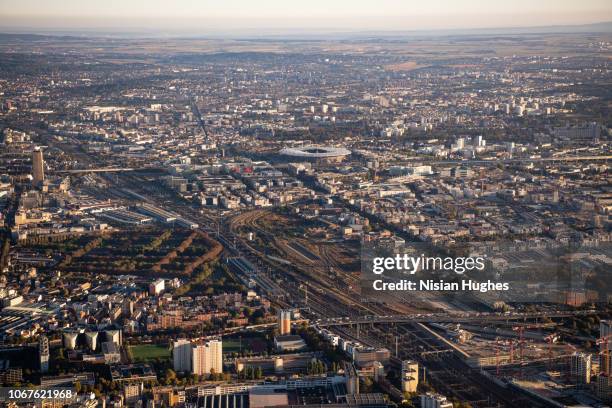 aerial flying over paris france with view of stade de france at sunrise - saint denis paris stock pictures, royalty-free photos & images