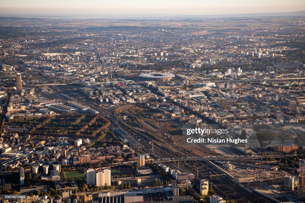 Aerial flying over Paris France with view of Stade de France at sunrise