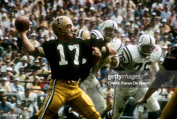 Quarterback Billy Kilmer of the New Orleans Saints drops back to pass against the Baltimore Colts during an NFL football game at Tulane Stadium...