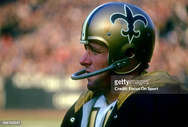 Quarterback Billy Kilmer of the New Orleans Saints looks on from the sidelines during an NFL football game circa 1969. Kilmer played for the Saints...