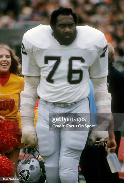 Bob Brown of the Oakland Raiders looking on from the sidelines against the Kansas City Chiefs during an NFL game at Arrowhead Stadium circa 1971 in...