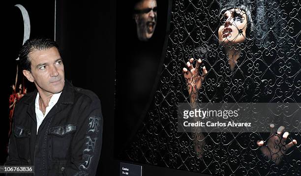 Actor Antonio Banderas poses in front of exhibits during the launch of his first photography exhibition 'Secretos Sobre Negro' at the Instituto...