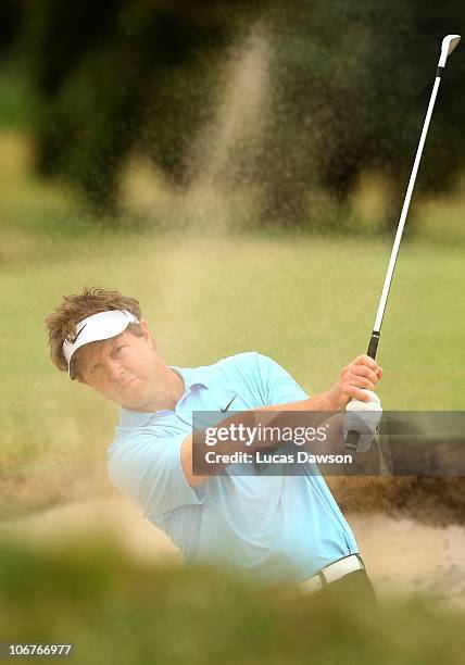 Scott Laycock of Australia plays a shot out of the bunker during round 2 of the Australian Masters at The Victoria Golf Club on November 12, 2010 in...