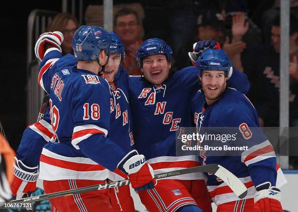 Marc Staal, Michael Sauer, Ruslan Fedotenko and Brandon Prust of the New York rangers celebrate Fedotenko's first period goal against the Buffalo...