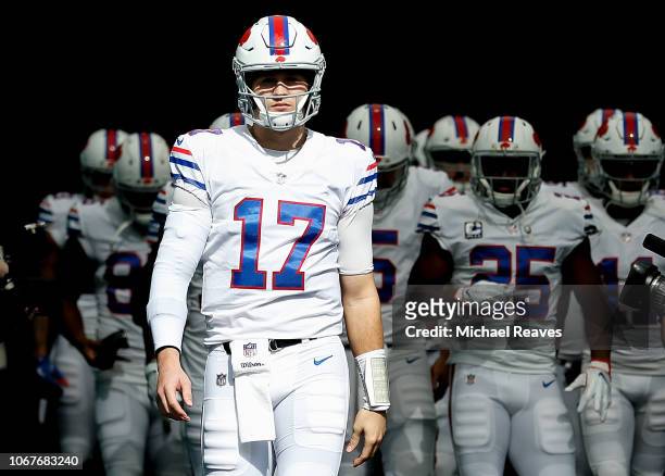 Josh Allen of the Buffalo Bills leads the team on to the field prior to the game between the Miami Dolphins and the Buffalo Bills at Hard Rock...