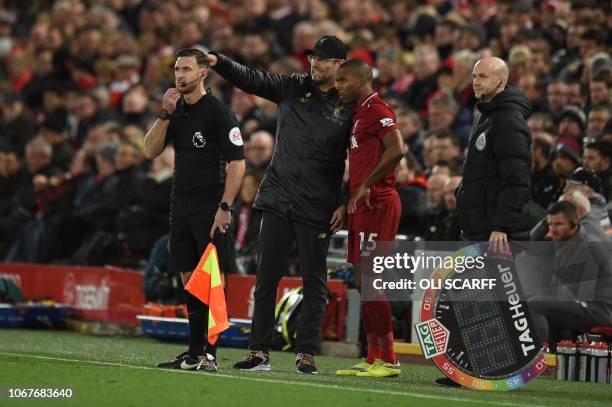 Liverpool's English striker Daniel Sturridge is given instruction by Liverpool's German manager Jurgen Klopp as he comes on as a substitute during...