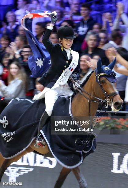 Winner Edwina Tops-Alexander of Australia riding California and carrying the australian flag celebrates winning the Longines Grand Prix 2018, a CSI5...