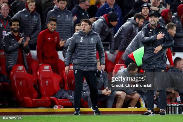 Second Assistant coach at Liverpool, Peter Krawietz and Jurgen Klopp react during the Premier League match between Liverpool FC and Everton FC at...