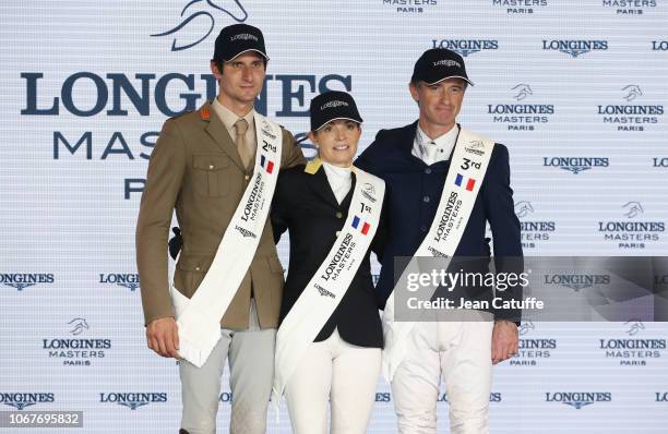 Second place Alberto Zorzi of Italy riding Contanga 3, winner Edwina Tops-Alexander of Australia, Denis Lynch of Ireland riding The Sinner during the...