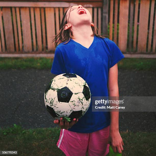 rain soccer - standing in the rain girl stock pictures, royalty-free photos & images