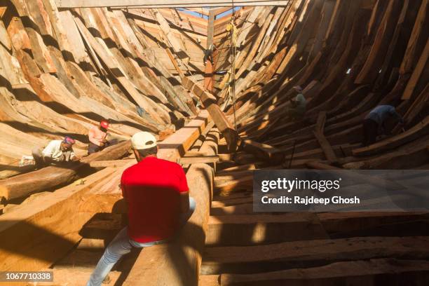 wooden shipbuilding yard at mandvi - ship builders stock pictures, royalty-free photos & images
