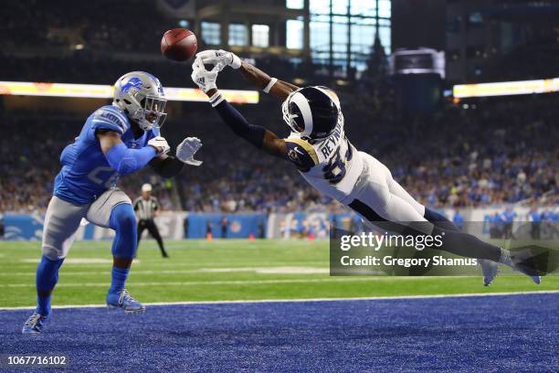 Quandre Diggs of the Detroit Lions breaks up a pass intended for Josh Reynolds of the Los Angeles Rams during the first half at Ford Field on...