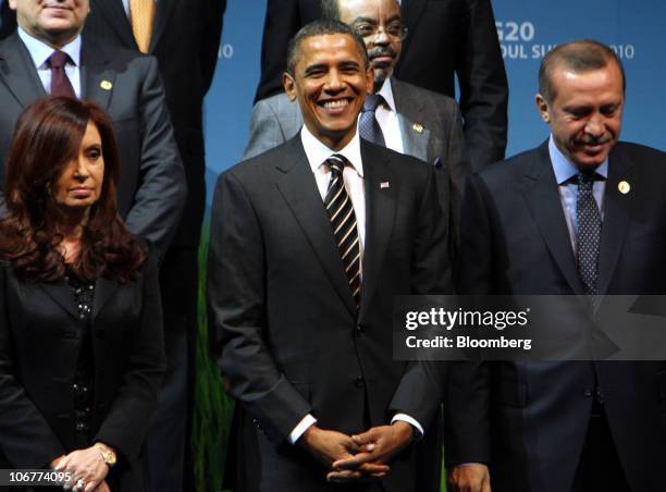 President Barack Obama, center, takes part in a group photo session with other leaders from the Group of 20 nations at the G-20 Seoul Summit 2010, in...
