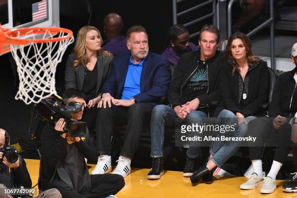 Heather Milligan, Arnold Schwarzenegger, Rande Gerber and Cindy Crawford attend a basketball game between the Los Angeles Lakers and the Portland...