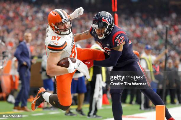 Seth DeValve of the Cleveland Browns is forced out of bounds near the goal line in the third quarter by Tyrann Mathieu of the Houston Texans at NRG...