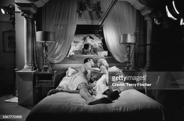 Scottish actor Sean Connery and Italian actress Daniela Bianchi rehearse and film a bedroom scene for the James Bond film 'From Russia With Love' at...