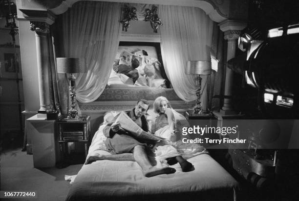 Scottish actor Sean Connery and Italian actress Daniela Bianchi rehearse and film a bedroom scene for the James Bond film 'From Russia With Love' at...