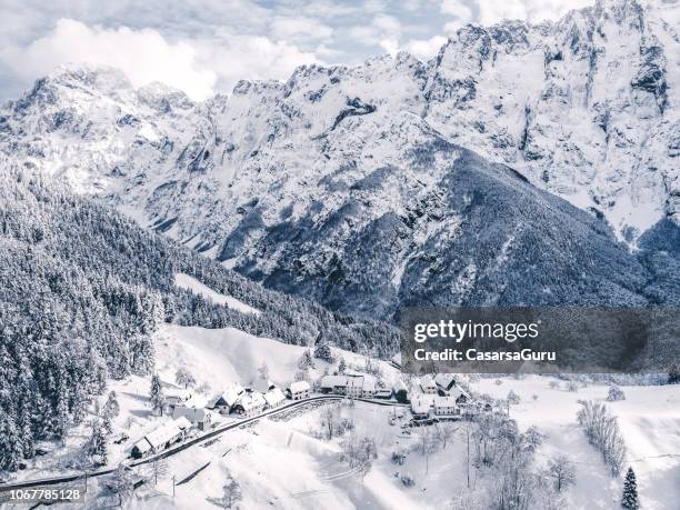 idyllic winter landscape from above - slovenia winter stock pictures, royalty-free photos & images