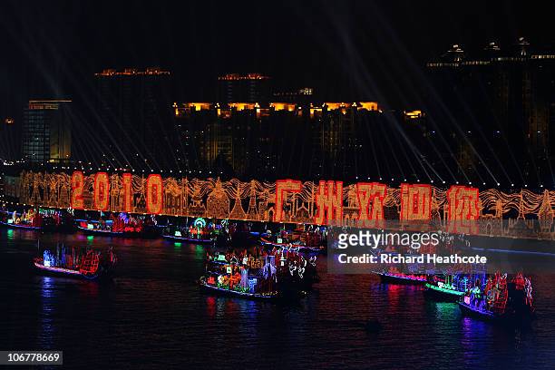 Boats representing the 45 Asian nations float down the Pearl river during the Opening Ceremony for the 16th Asian Games Guangzhou 2010 at Haixinsha...