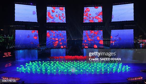 Artists perform during the opening ceremony of the 16th Asian Games in Guangzhou on November 12, 2010. The 15-day Asian Games officially opened with...