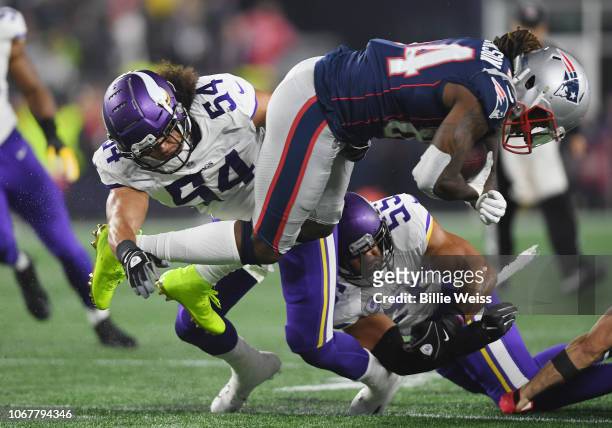 Cordarrelle Patterson of the New England Patriots is tackled by Eric Kendricks and Anthony Barr of the Minnesota Vikings during the first half at...