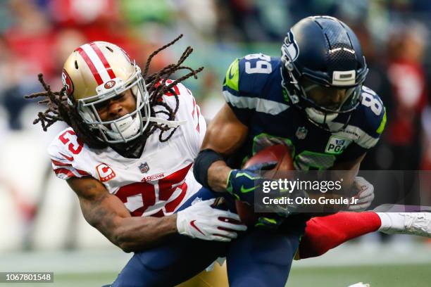 Richard Sherman of the San Francisco 49ers attempts to tackle former teammate Doug Baldwin of the Seattle Seahawks in the third quarter at...