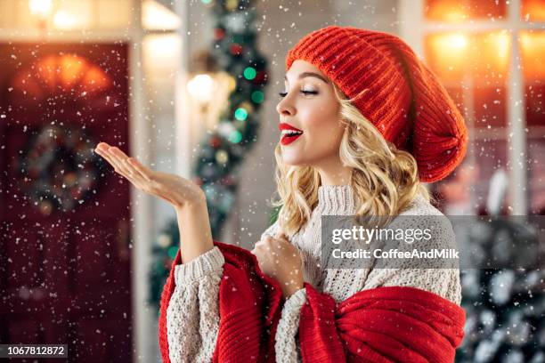 beautiful girl near decorated house - beautiful woman christmas stock pictures, royalty-free photos & images