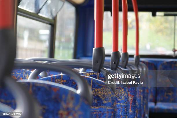 cropped shot of empty seats on a public bus - vehicle seat stock pictures, royalty-free photos & images