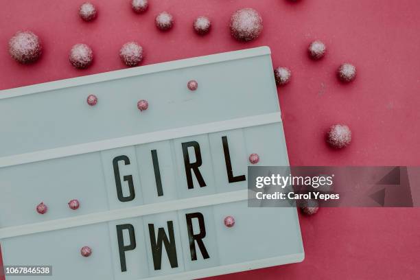 girl power message in lightbox.top view - light box stock-fotos und bilder