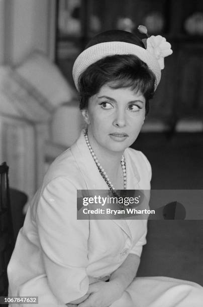 Iralian actress Gina Lollobrigida pictured seated in a hotel room in London on 25th June 1963. Gina Lollobrigida is in London to start work on the...