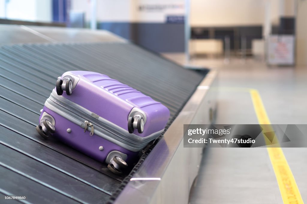 Suitcase or luggage with conveyor belt in the airport. Lost luggage