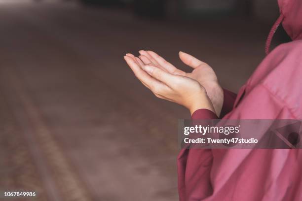 young muslim woman praying in mosque - prayer beads stock pictures, royalty-free photos & images