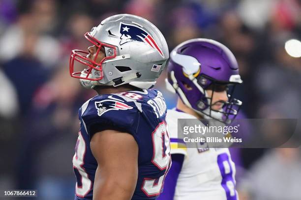 Trey Flowers of the New England Patriots reacts in front of Kirk Cousins of the Minnesota Vikings during the second half at Gillette Stadium on...