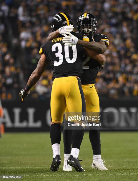 James Conner of the Pittsburgh Steelers celebrates with Stevan Ridley after a 1 yard rushing touchdown during the first quarter in the game against...