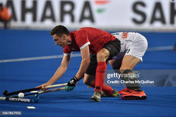 Tim Drummond of South Africa and Oliver Schofield of Canada during the FIH Men's Hockey World Cup Pool C match between South Africa and Canada at...