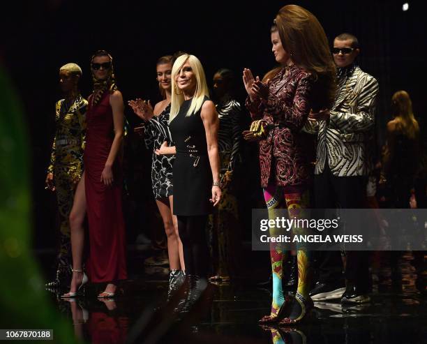 Italian designer Donatella Versace poses for pictures at the Versace Pre-Fall 2019 Runway Show on December 2, 2018 in New York City.