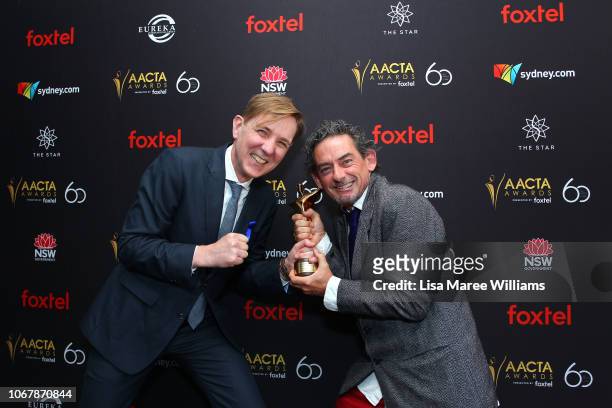 Robert Mackenzie and David White pose with an AACTA Award for Best Sound in a Documentary for Mountain during the 2018 AACTA Awards Presented by...
