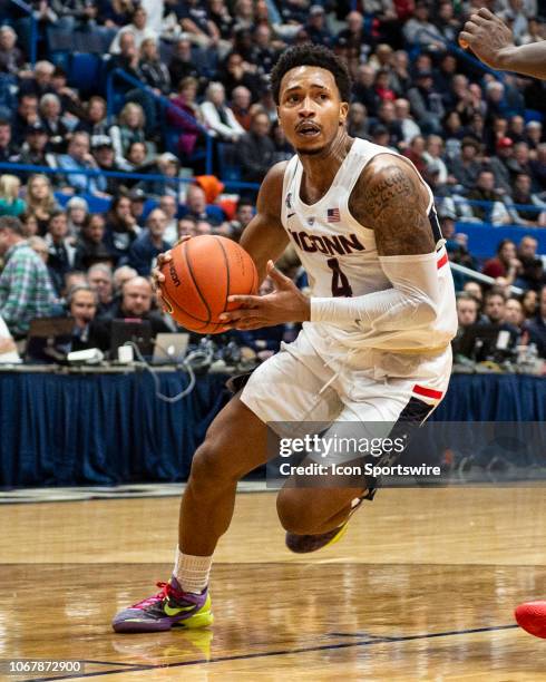 Connecticut Huskies guard Jalen Adams drives toward the basket during the first half of the Arizona Wildcats versus the Connecticut Huskies game on...